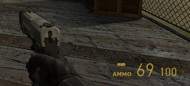 Pistol with 69 rounds addon